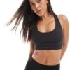 Puma Evolve Training Mid Impact Support Sports Bra In Black For Women